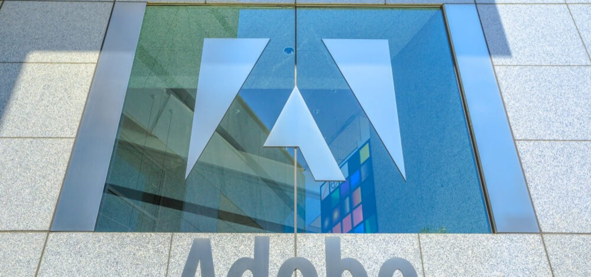 Adobe palace window with logo.