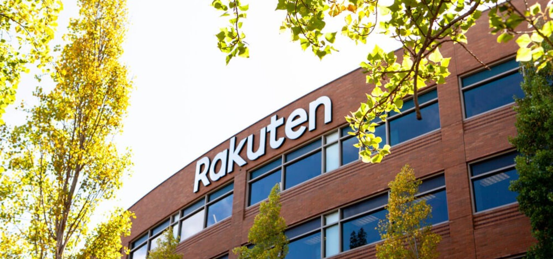 Rakuten: A logo sign of Rakuten outside of the headquarters.