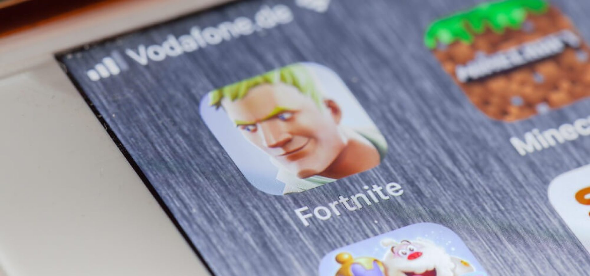 Fortnite game app on screen of smartphone.