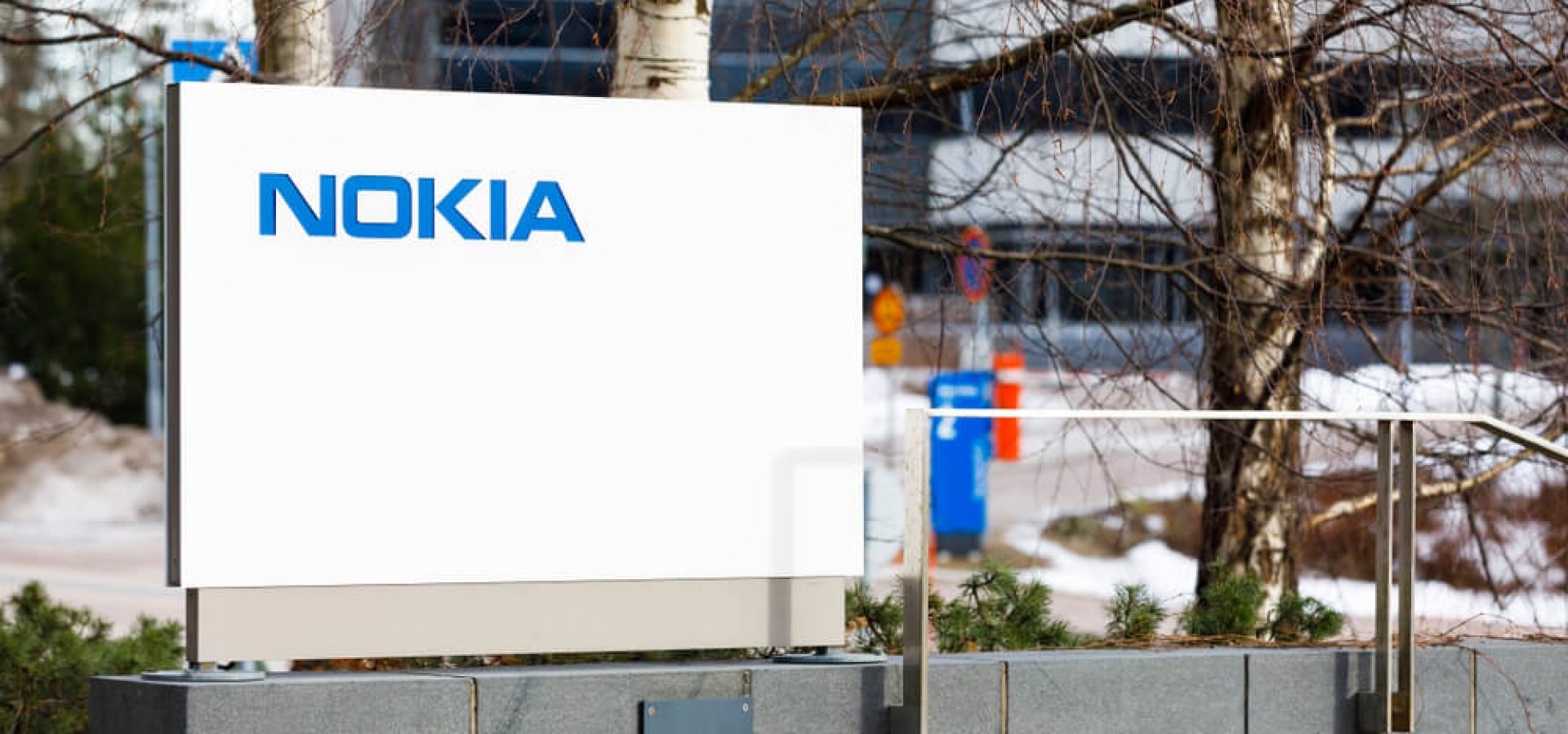 Nokia: Nokia company name on white board next to Nokia head quarter.