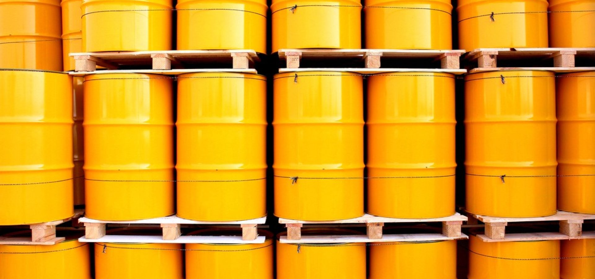 Wibest – Oil petroleum: Yellow oil barrels stacked together.