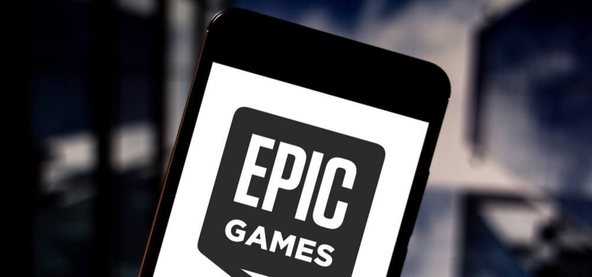 Epic Games logo is displayed on a smartphone.