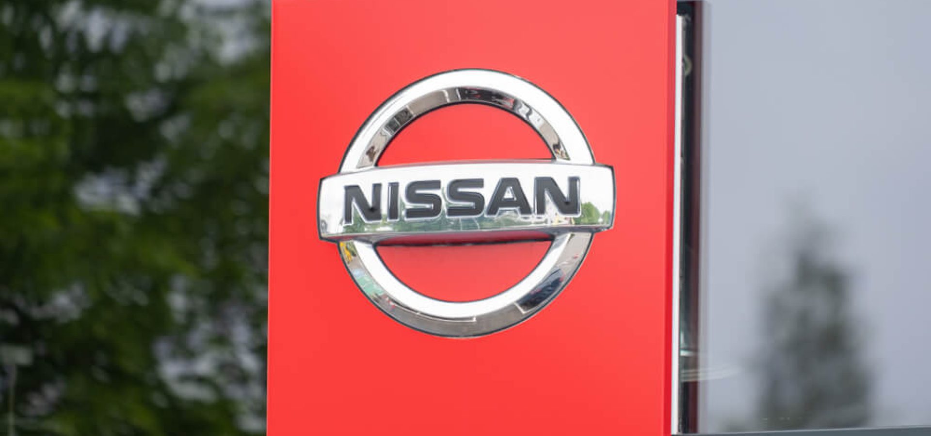 Wibest Broker — Carmaker: Nissan sign and logo.