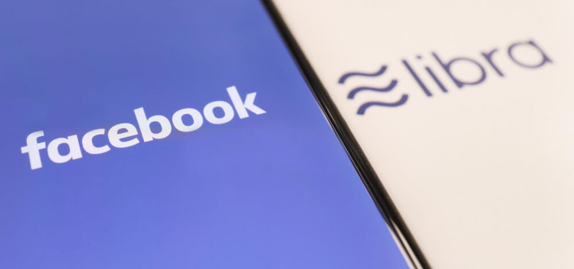 Wibest – Facebook Libra: FB Libra Header Image Alt-Tag: Wibest – Facebook Libra: Facebook Logo with Libra on Mobilephone Screen.