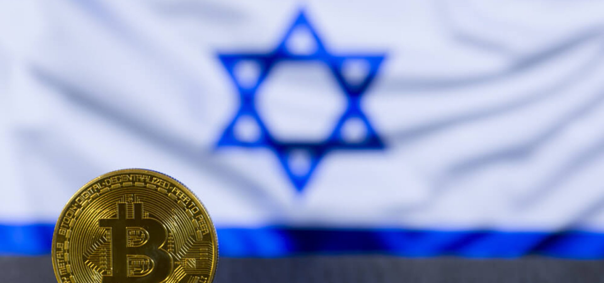 Digital Coins: Bitcoin golden coin with Israel flag in the background