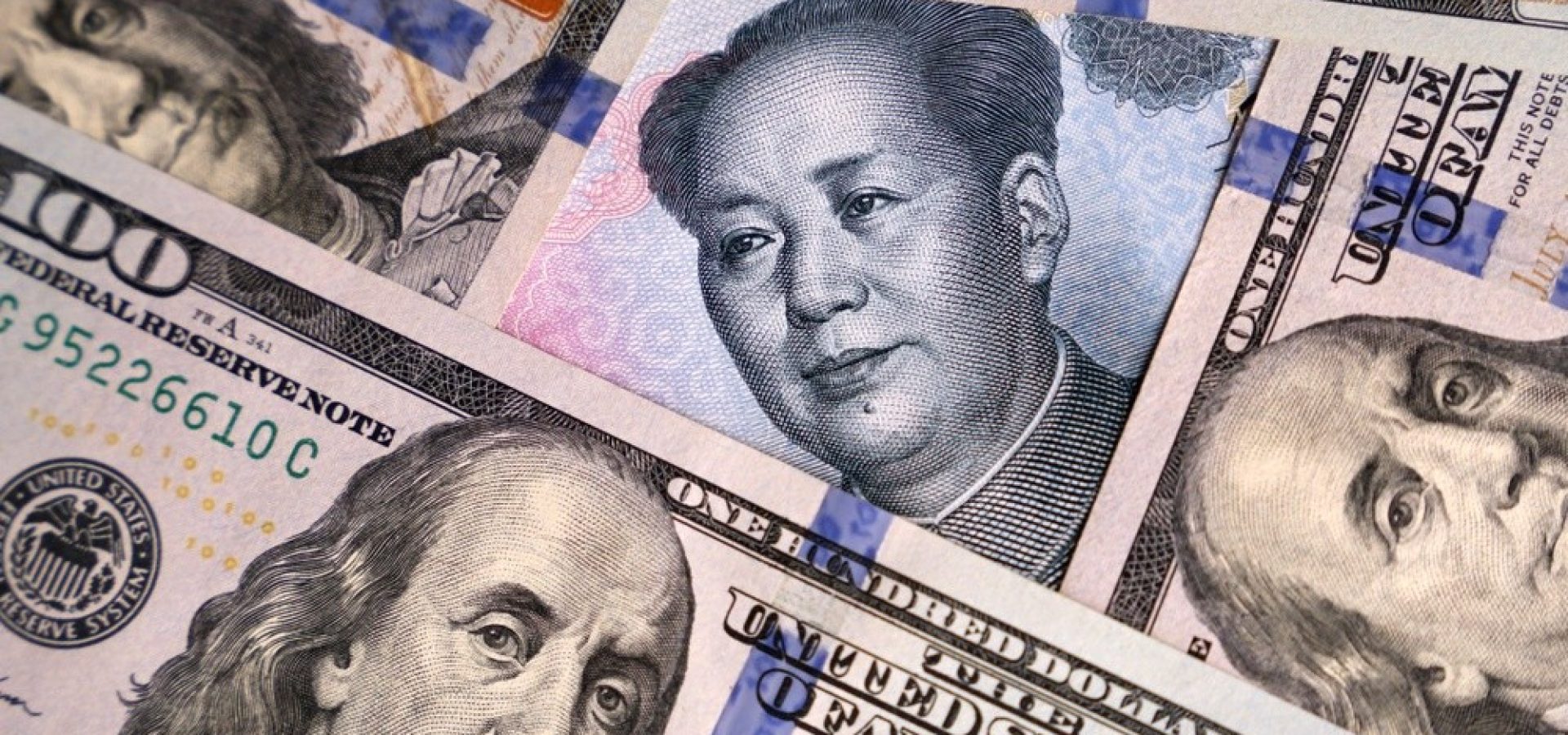 Wibest – Yuan: US dollar and Chinese yuan bills.