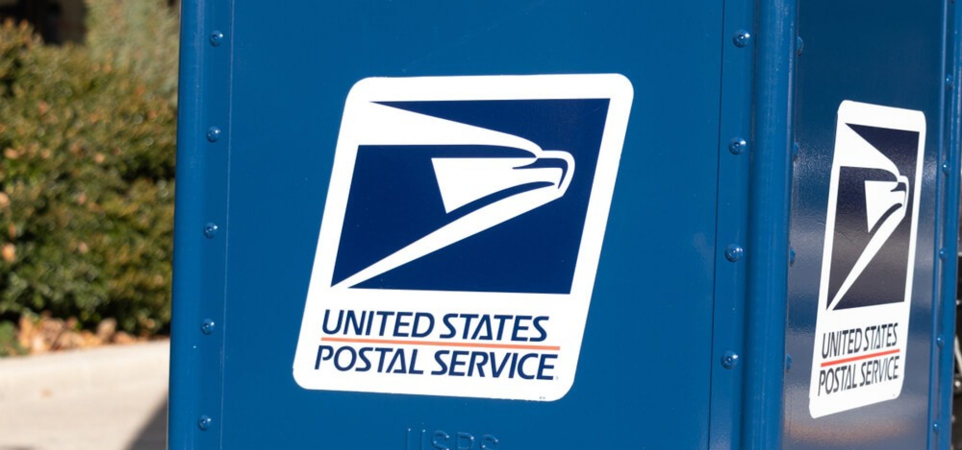 USPS logo on the side of a new drop-box.