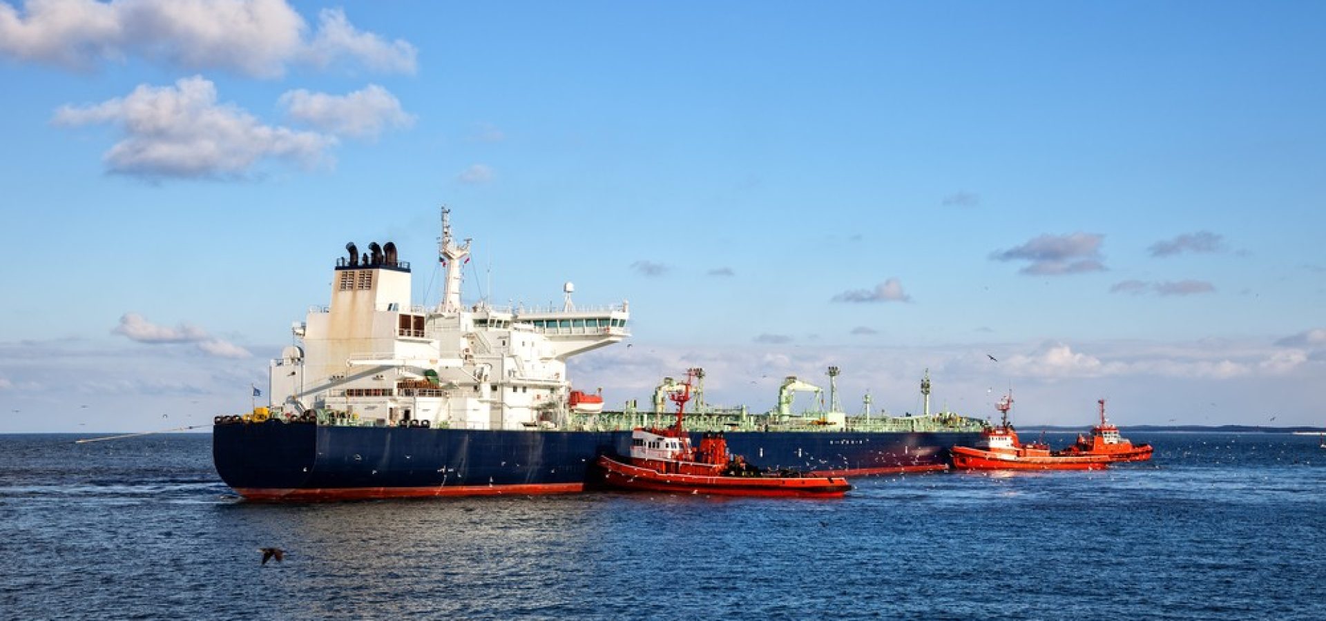 Wibest – Tanker Ship: A crude oil tanker ship in the middle of the sea.