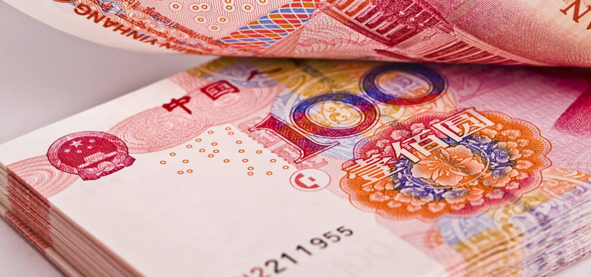 Wibest – USD to CNY: A stack of 100-yuan bills.