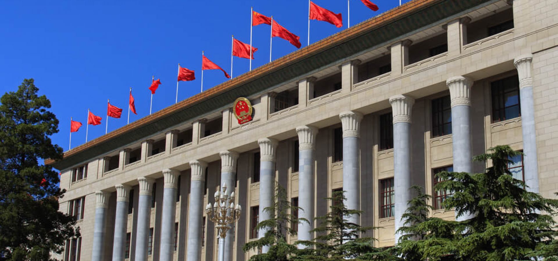 Digital Coins: Great Hall of the People with flag of china.