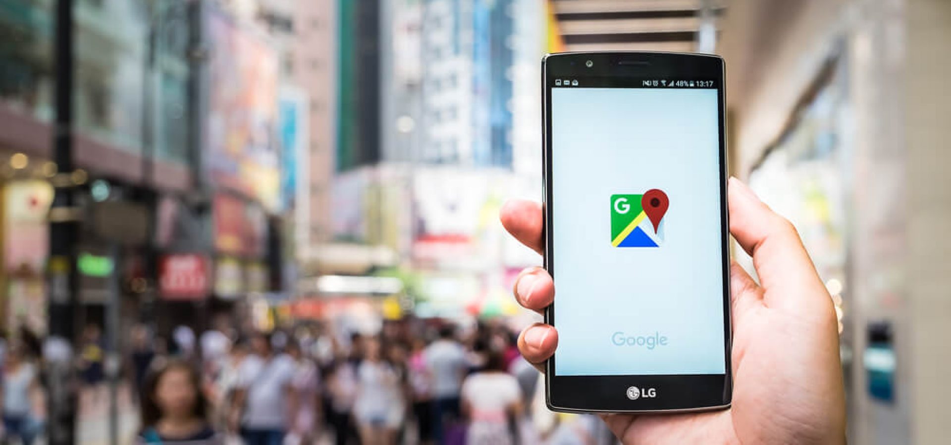 google, A man hand holding screen shot of google maps app showing on LG G4.