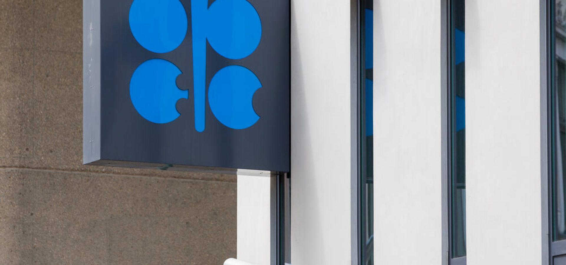OPEC: Building Organization of the Petroleum Exporting Countries with OPEC logo.