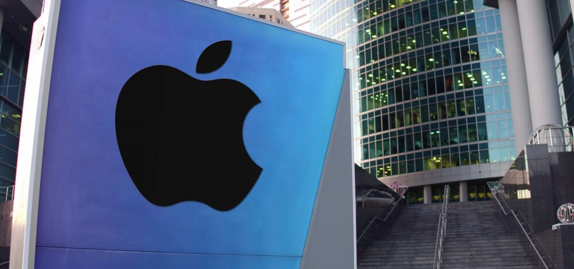 Apple: Street signage board with Apple Inc. logo.