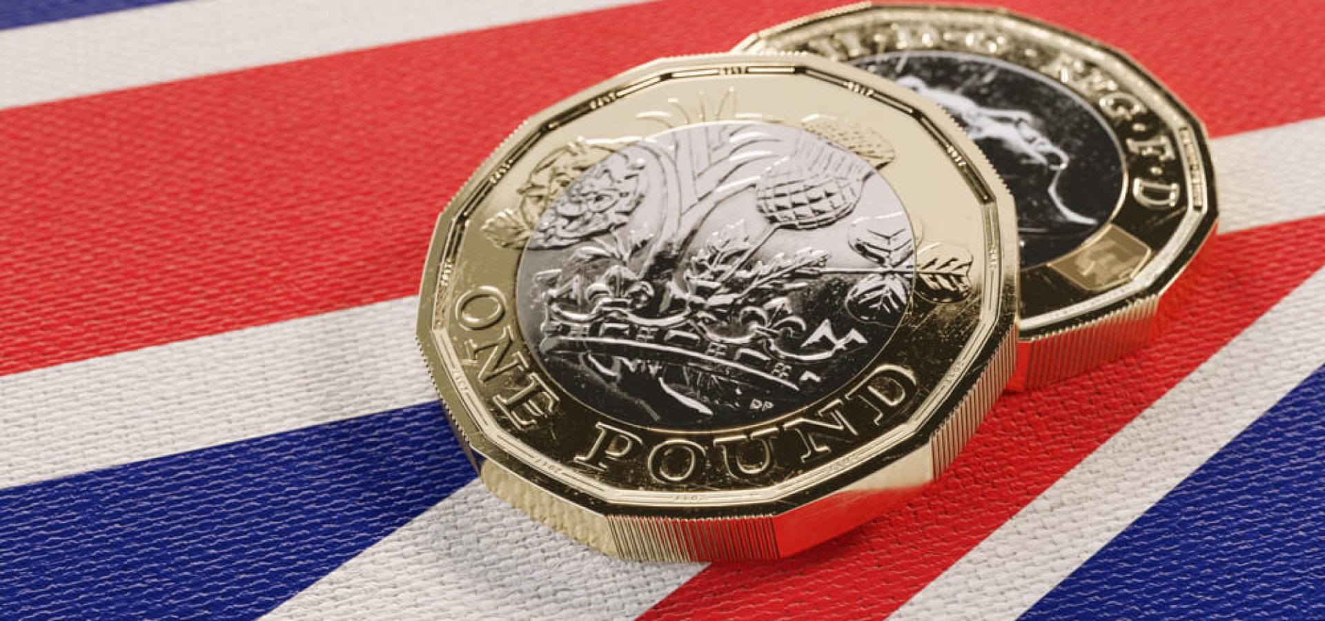 Wibest – Sterling: Pound Sterling coins on top of the UK flag.