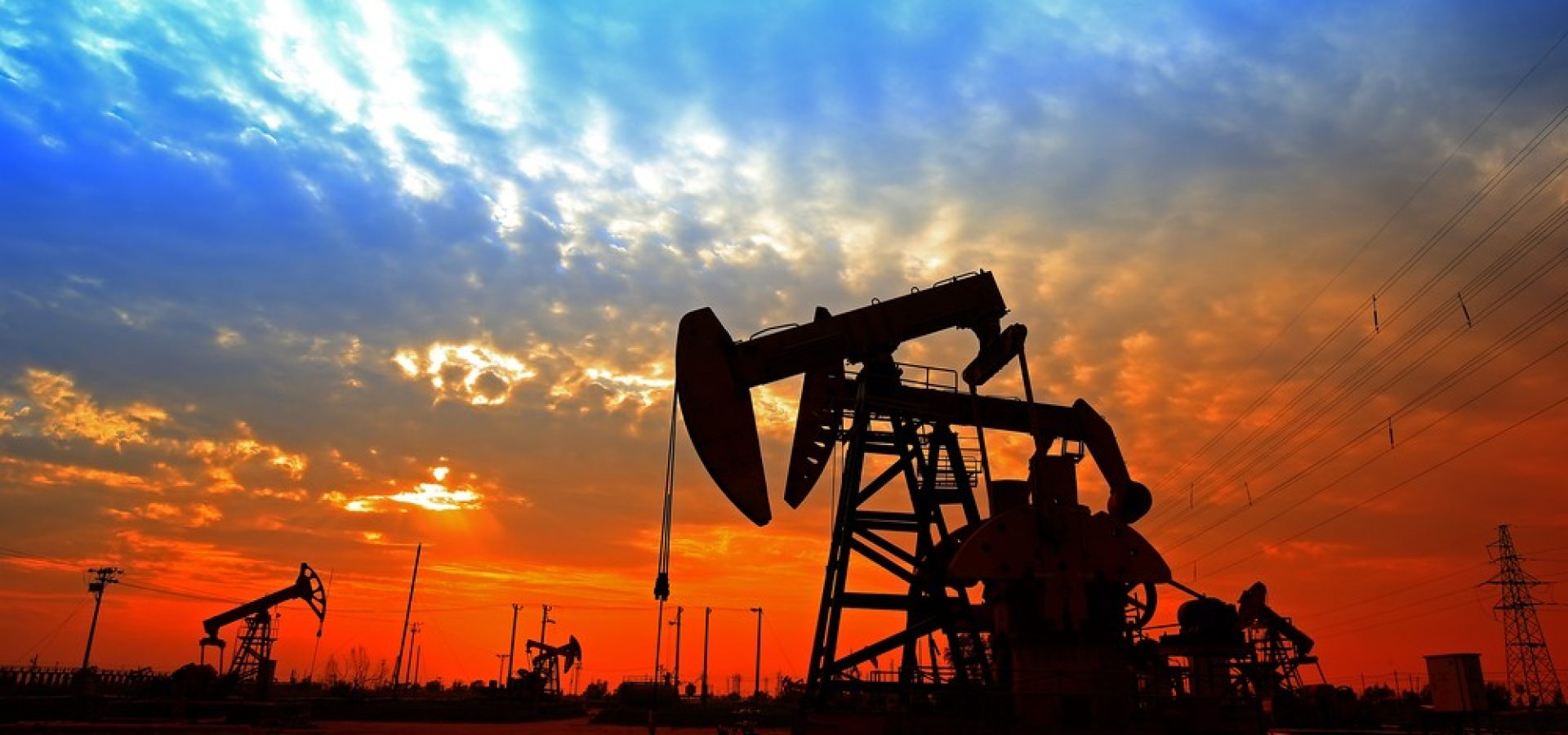 Wibest – Oil Prices: Oil pump-jack over the sunset.