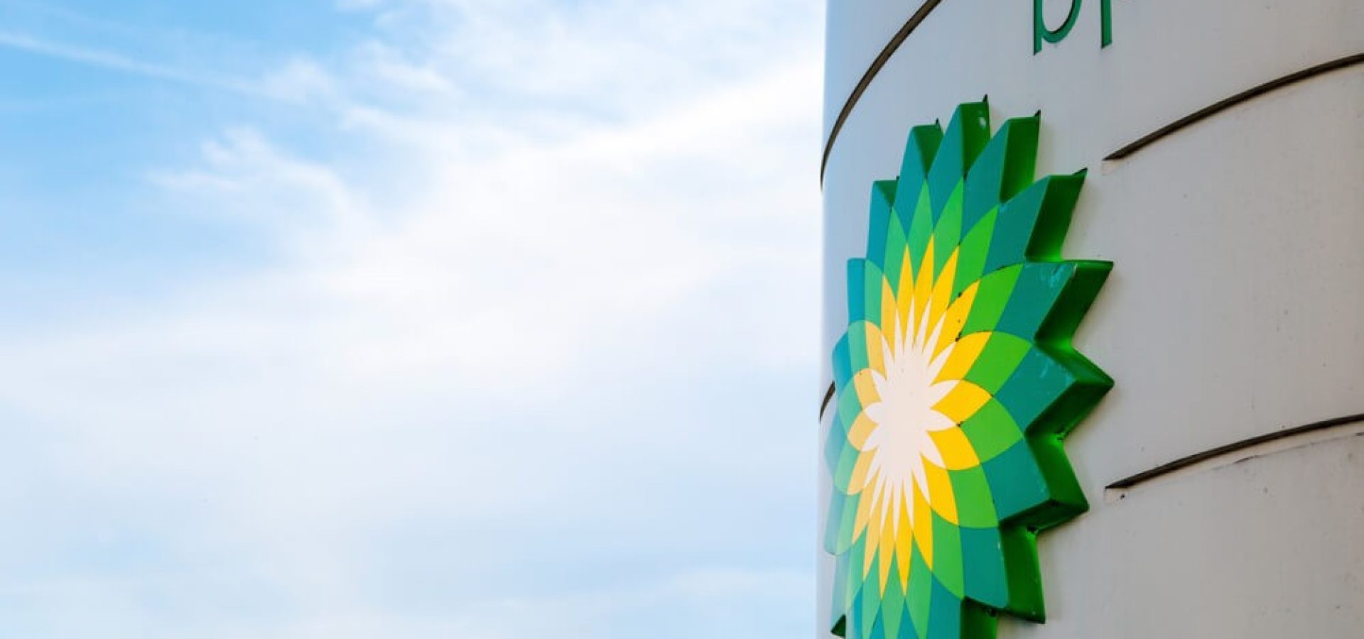 BP: BP display stand with company redesign logo in blue sky background.