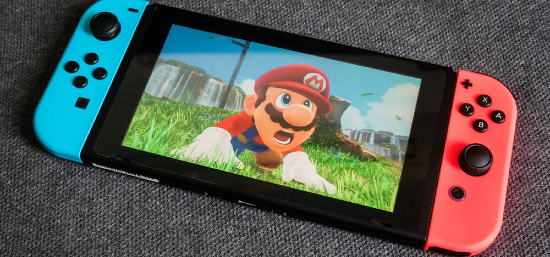 Mario: Nintendo Switch showing its screen with Super Mario.