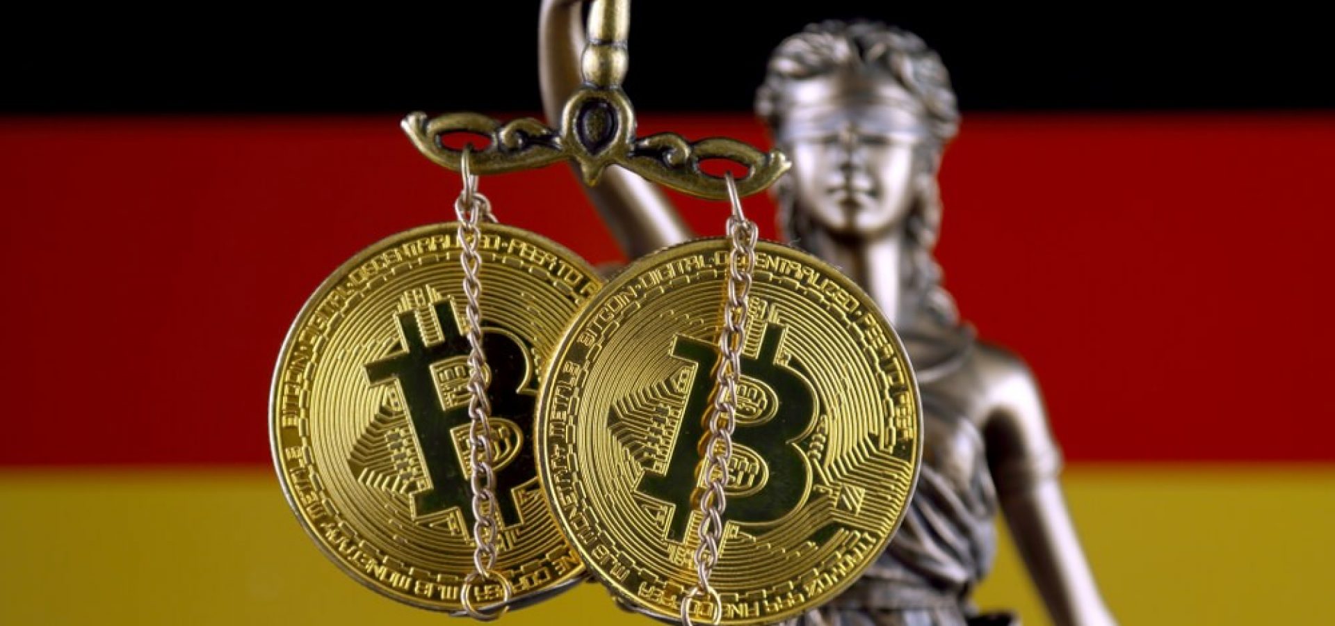 German: Symbol of law and justice, physical version of Bitcoin and Germany Flag.