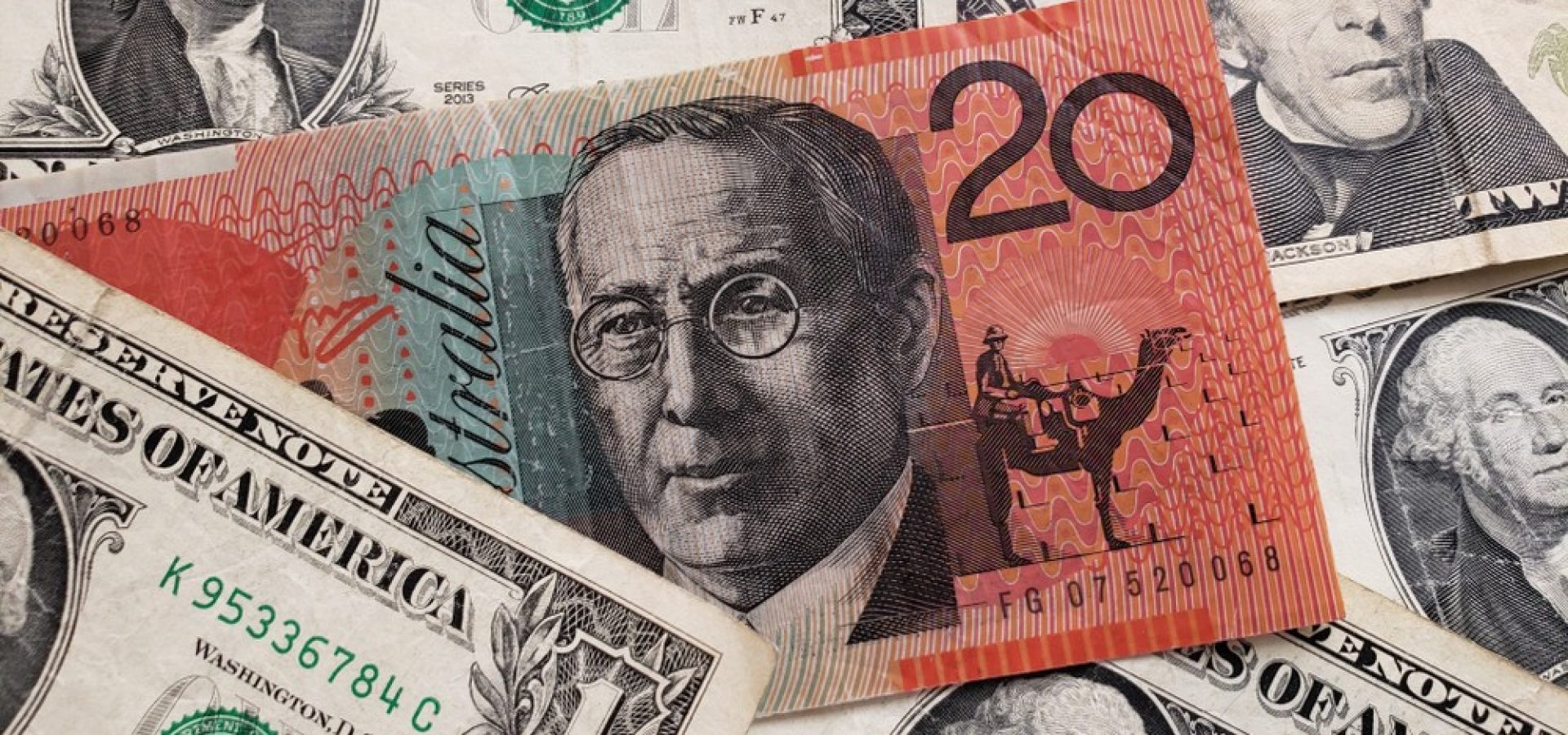 The Greenback: US dollar and Australian dollar banknotes.