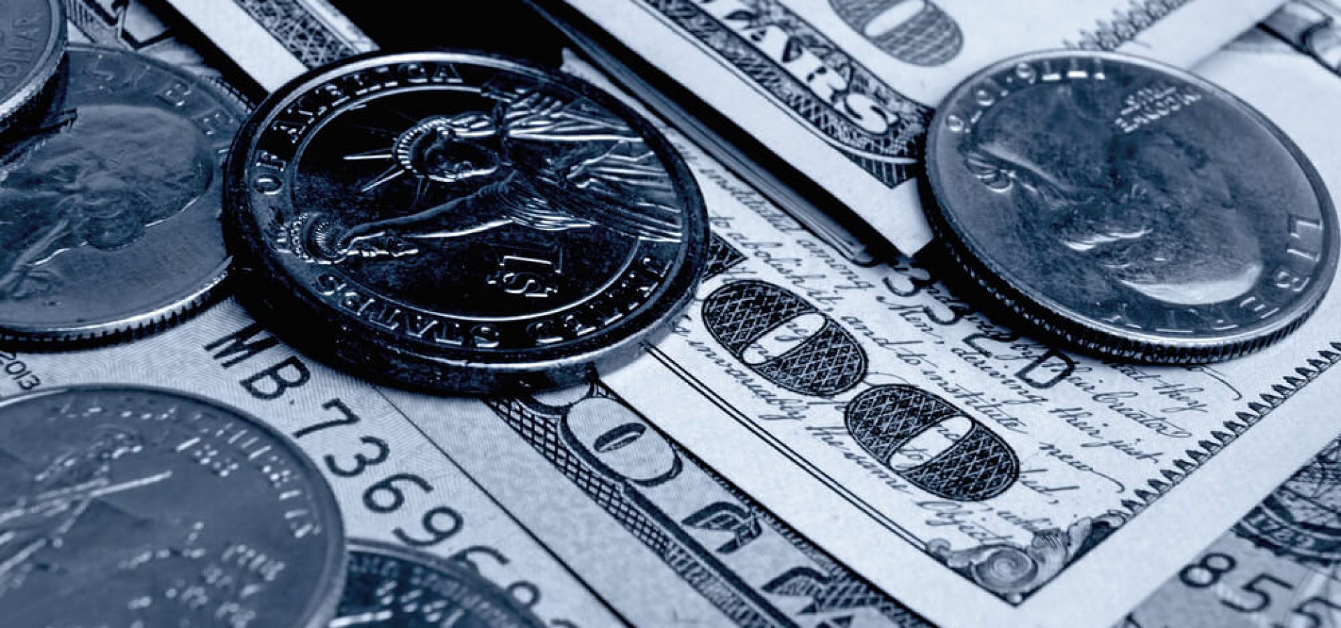 Dollar bills and coins close up shot